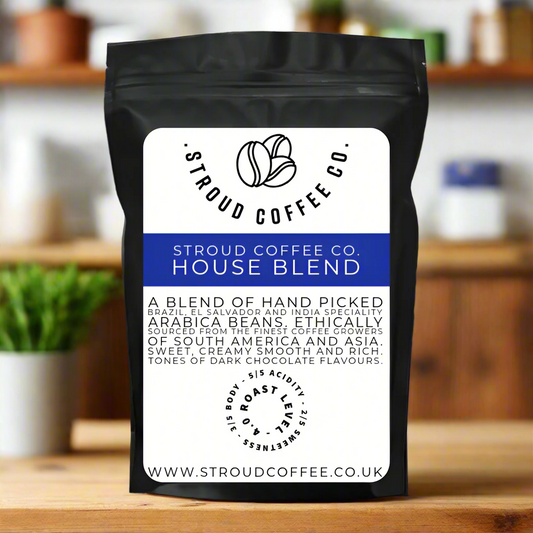 A packaged bag of Stroud Coffee Co. House Blend coffee beans, with information about the product printed on the front.